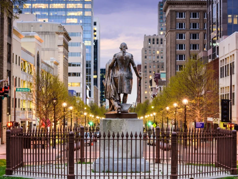 Historic statue in downtown Raleigh, North Carolina, symbolizing the city's cultural heritage and the notable individuals who have shaped Raleigh's history and national influence.