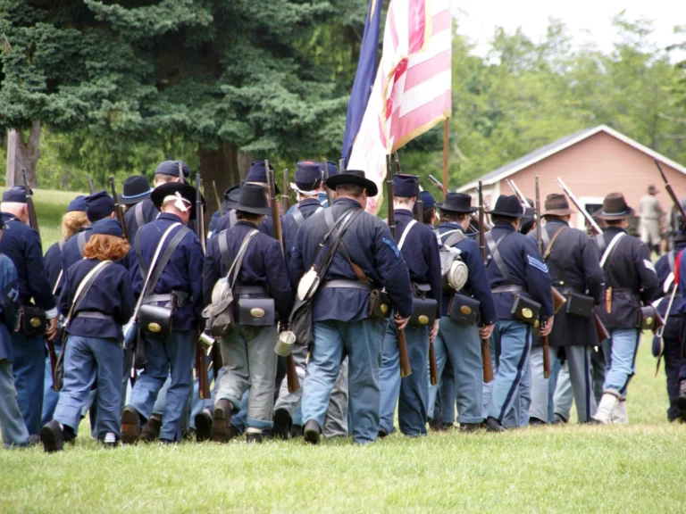 Civil War reenactors representing Union troops during Sherman's March through North Carolina, reflecting the events that led to the peaceful surrender and occupation of Raleigh in April 1865.